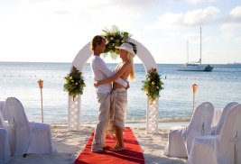 Bride and groom at altar right on the beach